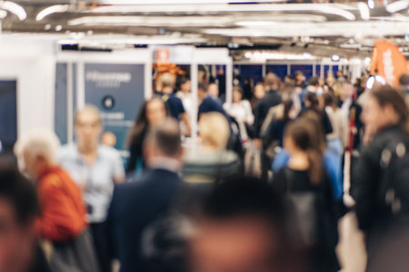 Abstract blurred people at exhibition hall of expo event trade show. Business convention show or job fair. Business concept backgroundの写真素材
