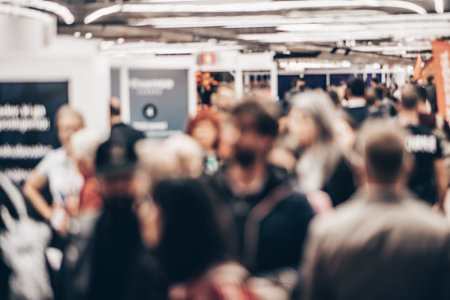 Abstract blurred people at exhibition hall of expo event trade show. Business convention show or job fair. Business concept backgroundの写真素材