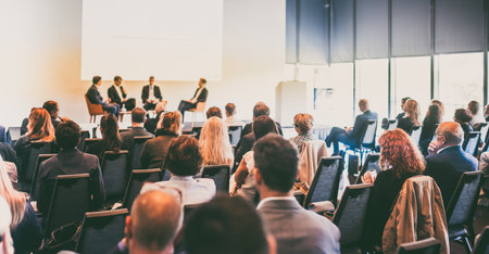 Interview and round table discussion at business convention and presentation. Audience at the conference hall. Business and entrepreneurship symposium.の写真素材
