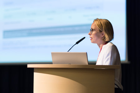 Female speaker giving a talk on corporate business conference. Business and Entrepreneurship eventの写真素材