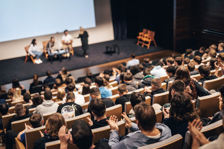 Interview and round table discussion at business convention and presentation. Audience at the conference hall. Business and entrepreneurship symposium.の写真素材