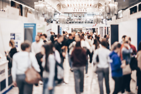 Abstract blurred people at exhibition hall of expo event trade show. Business convention show or job fair. Business concept background.の写真素材