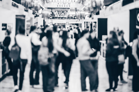 Abstract blurred people at exhibition hall of expo event trade show. Business convention show or job fair. Business concept background. Black and white image.の写真素材