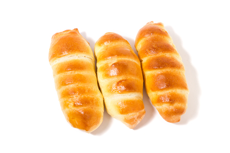 flour product, fresh buns, isolate, three sausages in the doughの写真素材