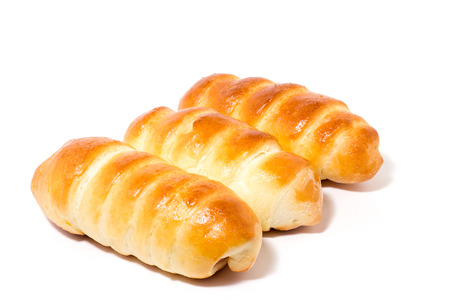 flour product, fresh buns, isolate, three sausages in the doughの写真素材