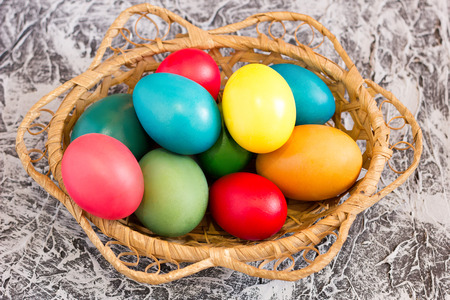 basket with Easter eggs on the background of a concrete background, concept for the holiday of Easter, spring holidayの写真素材