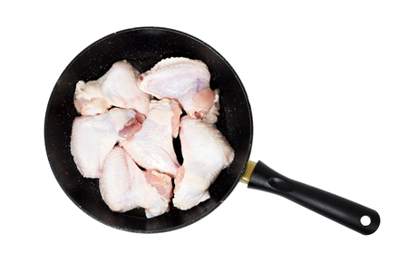 pieces of raw chicken meat in a pan, isolateの写真素材