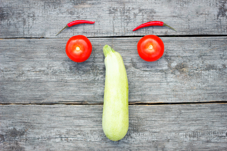smile of tomato, zucchini and red pepper, top view, healthy food, vegetable conceptの写真素材