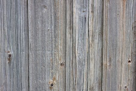 Background of old boards. Wooden old fence close-up. Wood textureの写真素材