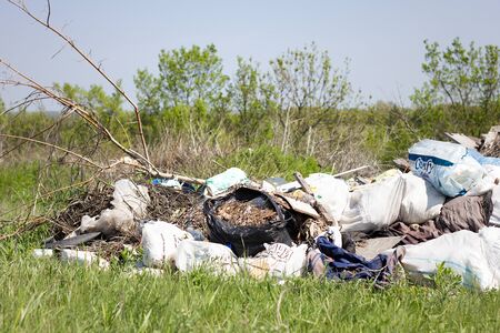 garbage dump in the field. Environmental pollution. Global problems of mankind.の写真素材
