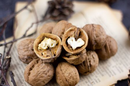 a group of walnuts on a dark background, a concept for the winter season.