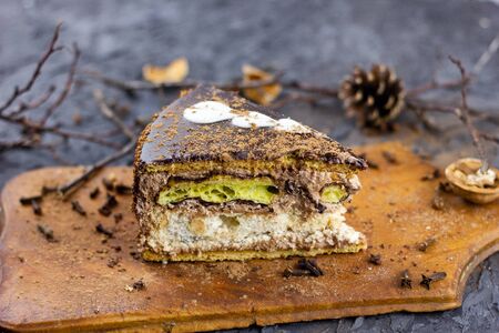 a piece of winter cake. Winter baking. A piece of cut cake baked for winter holidaysの写真素材