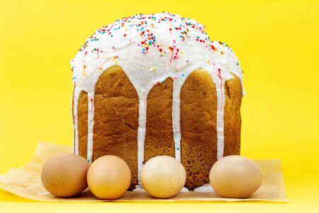 homemade Easter cupcake on a pastel yellow background, a concept for Easter. Large cake with Easter...