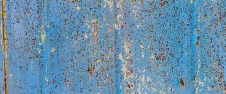 panorama texture of peeling paint close-up, space splot. Shabby paint on rusty metal. Rough texture.の写真素材