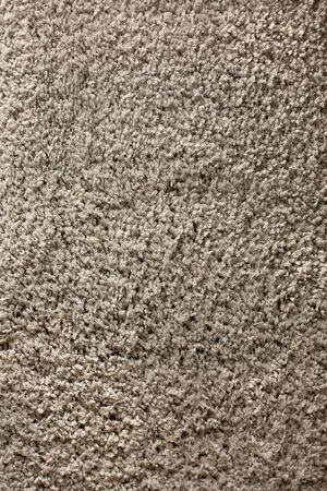 Handmade fluffy carpet texture, closeup. Wallpaper. Home rug, natural clean background
