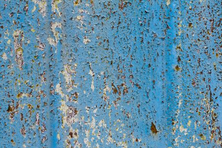 peeling paint on metal close-up with copy space. Rough texture with peeling paint. Workpiece for...