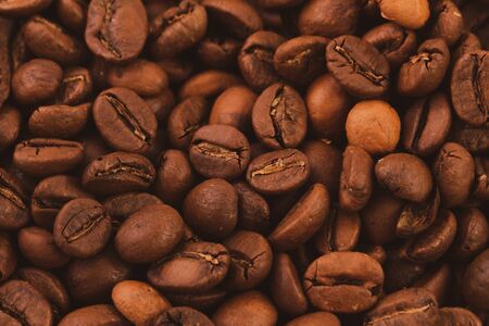 texture of roasted coffee beans close-up, top view. natural fruits of the coffee bushの写真素材