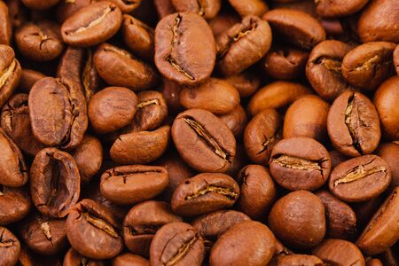 texture of roasted coffee beans close-up, top view. natural fruits of the coffee bushの写真素材