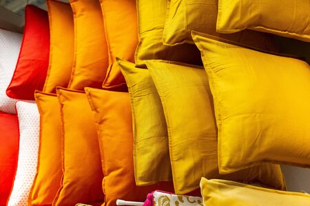 a set of multi-colored pillows in limbo in a supermarket, with a place for an inscription. Greater selection of soft pillowsの写真素材