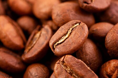 macrophotography of coffee beans, the Texture of coffee beans. Roasted coffee beans on a dark backgroundの写真素材