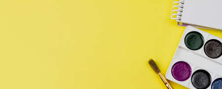 Colorful drawing set on a yellow background. Photo banner. View from above. Place for text.の写真素材