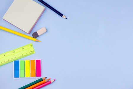 All kinds of colorful school supplies on a blue background. Place for text. View from above. Education concept.の写真素材