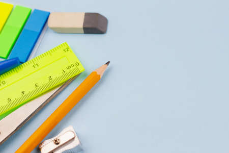 School new supplies on a light blue background. Photo banner. View from above. Place for text.の写真素材