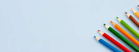 Colored colorful pencils on a light gray background. Photo banner. View from above. Place for text.の写真素材
