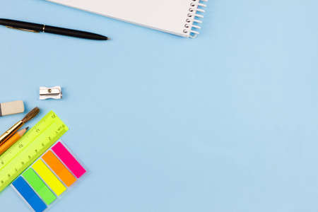 Colored various school supplies on a light blue background. Place for your text. View from above. Education concept.の写真素材