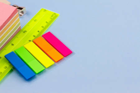 Colorful stickers with accessories on a light blue background. Place for your text. View from above.の写真素材