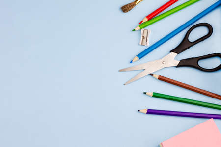 Various office supplies on a blue background. Photo banner. Place for your text. Education concept.の写真素材