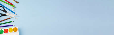 Various office supplies on a blue background. Photo banner. Place for your text. Education concept.の写真素材