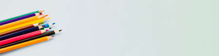 Colored colorful pencils on a light gray background. Photo banner. View from above. Place for text.の写真素材