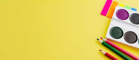 Colorful various office supplies on a yellow background. Banner photo. Place for your text. View from above. Education concept.の写真素材