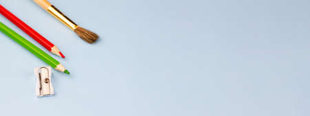 Brush with pencils on a blue background. Photo banner. Place for your text. Education concept.の写真素材