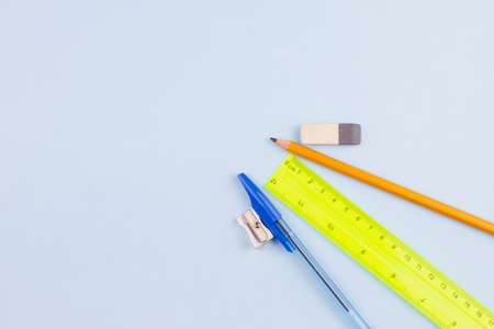 Essential school stationery on a light blue background. View from above. Place for text.の写真素材