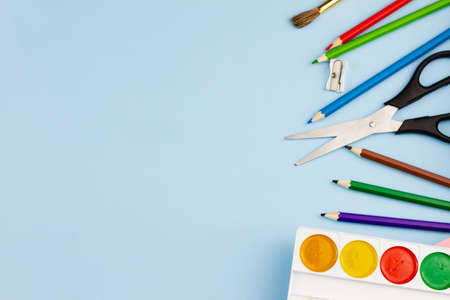 Various office supplies on a blue background. Photo banner. Place for your text. Education concept.の写真素材