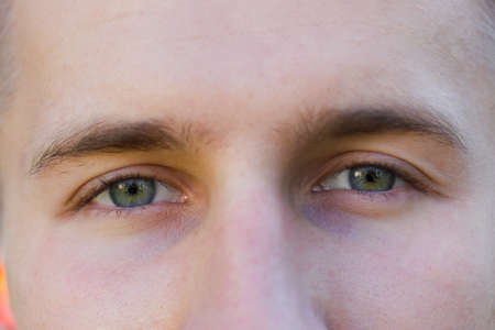 Blue-eyed look with a gray tint. Close-up.の写真素材