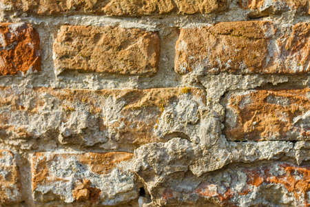 old red brick texture close up, rough surface of rough stoneの写真素材