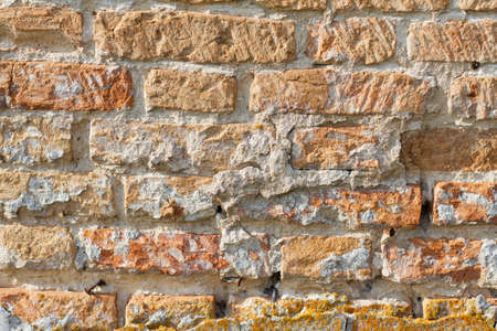 old red brick texture close up, rough surface of rough stoneの写真素材