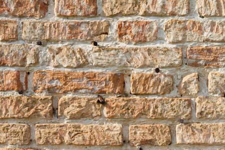 old red brick texture close up, rough surface of rough stoneの写真素材