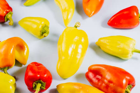 Group of ripe multicolored sweet peppers on gray background, food background, ripe vegetables conceptの写真素材