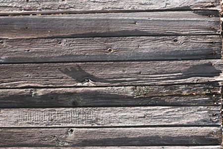 texture of the old fence . old village fence closeup . Old rough wooden backgroundの写真素材