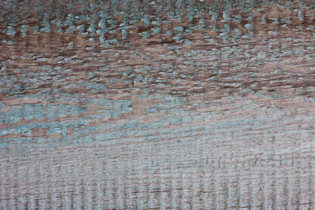 old peeling paint on a wooden background. Old shabby wooden background close-up. Rough paint textureの写真素材