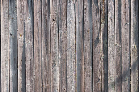 texture of the old fence . old village fence closeup . Old rough wooden backgroundの写真素材