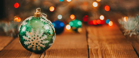 Merry Christmas. Christmas composition with holiday decorations on a wooden background. Christmas or New Year card. Background. Christmas symbol. Happy Holidays. photo bannerの写真素材