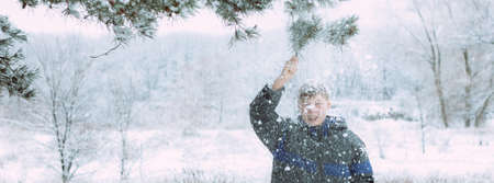Happy people have fun and play with snow outdoors in winter nature. Family Christmas walk in a snowy park at a ski resort with children. Winter holidays in the mountains with children photo bannerの写真素材