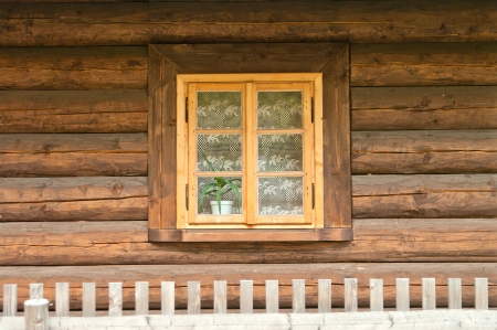 Window of a old wooden cottage. Retro style. の写真素材