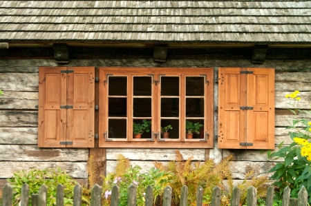 Window of a old wooden cottage. Retro style. の写真素材