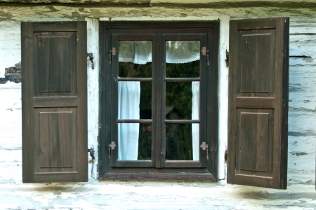 Window of a old wooden cottage. Retro style. の写真素材